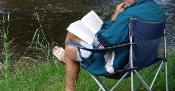 132 Content Old Man Reading Near River Germany